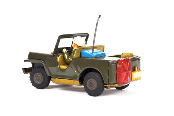 Vintage military toy car on white background