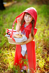 girl in the wood with a basket in hands. 