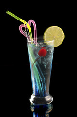 blue cocktail with ice and lime