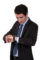 Businessman checking his watch