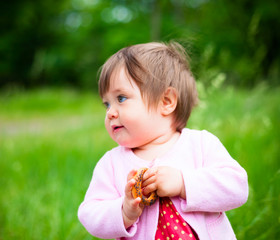 little girl eats bagel