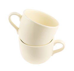 Ceramic cream colored cup pile isolated