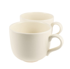 Two ceramic cream colored cups composition