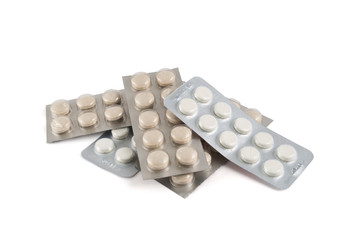 Pile of blister bubble pack pills isolated