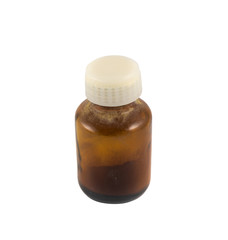 Brown glass medical vial of powder