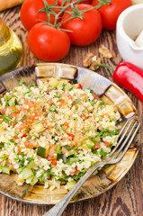 salad with bulgur, zucchini, tomatoes, chili peppers and parsley