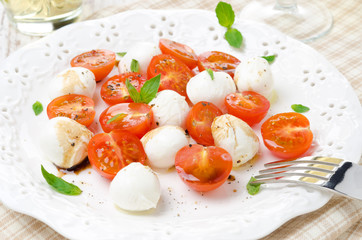 salad with mini mozzarella, cherry tomatoes and fresh basil