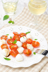 salad with mini mozzarella, cherry tomatoes and basil