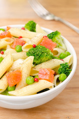salad with pasta, fish, broccoli and green peas