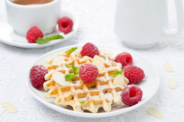 waffles with fresh raspberries, almonds and tea