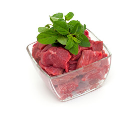 pieces of fresh beef in a glass bowl