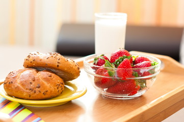 light breakfast on wooden tray