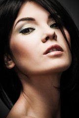 Fototapeta premium Portrait of a young beautiful brunette woman 