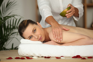 Naklejka na ściany i meble Woman receiving massage