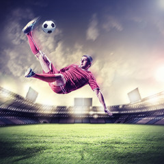 Fototapeta na wymiar football player striking the ball