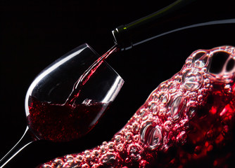 bottle and glass with red wine