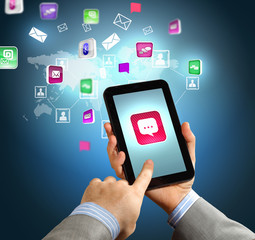 Close-up of hands holding tablet pc
