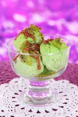 Delicious ice cream on table on bright background
