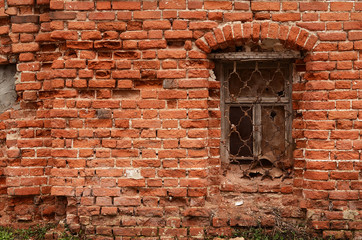 Fototapeta na wymiar Window of the old brick house