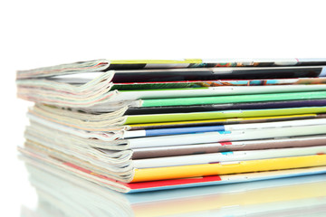 Many magazines isolated on white