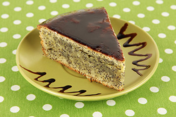 Delicious poppy seed cake on table close-up