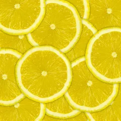 Fototapeten Abstrakter Hintergrund von Zitronenfruchtscheiben © macrowildlife
