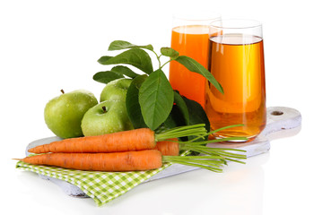 Glasses of juice, apples and carrots, isolated on white