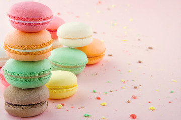 Colorful macaroons on pink background