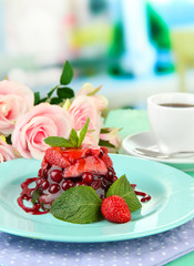 Tasty jelly dessert with fresh berries, on bright background