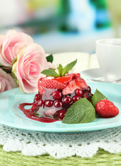 Tasty jelly dessert with fresh berries, on bright background