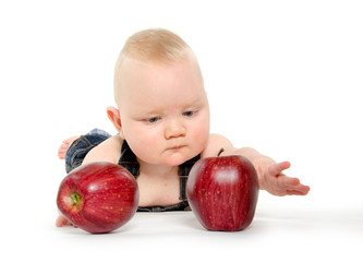 Fototapeta premium Baby boy playing with apples