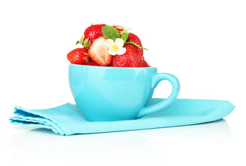 Ripe sweet strawberries in blue cup, isolated on white