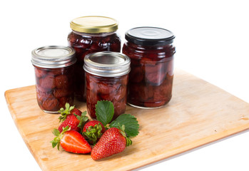Strawberry jam in a glass jar