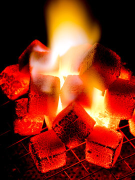 Live Coal And Flame Of Coconut Shell Charcoal Briquette