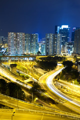 Fototapeta na wymiar Office buildings and highway in city at night
