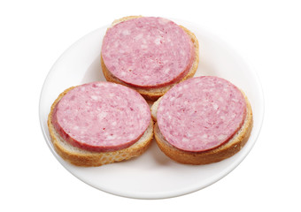 Three sandwiches with sausage