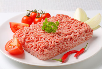 Raw ground pork and vegetables