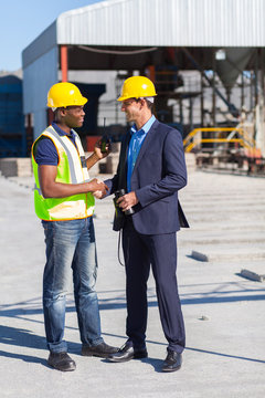 construction manager and worker handshake