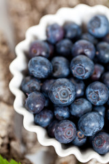 Fresh Blueberries in a white bowl. Macro.