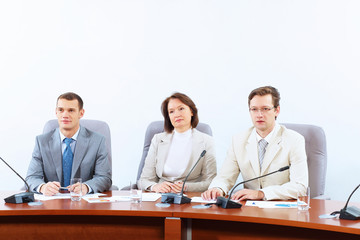 Three businesspeople at meeting