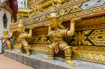 Fototapeta premium Inside a Buddhist temple are decorated with statues