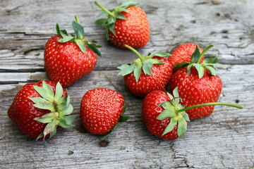 Fresh strawberries on old wooden background