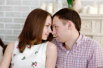 Young man and woman looking for tenderness and closeness