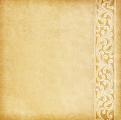 Old worn paper with floral border.