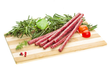 Salami with rosemary, basil and tomato