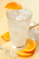 White drink with lemon and orange