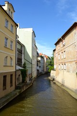 Fototapeta na wymiar Stream in Prague with houses