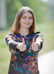 Attractive young woman on open air