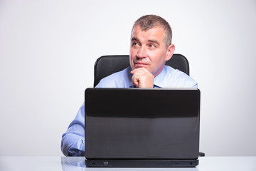 senior business man is pensive at laptop