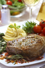 Delicious beef steak with spaniard and potatoes